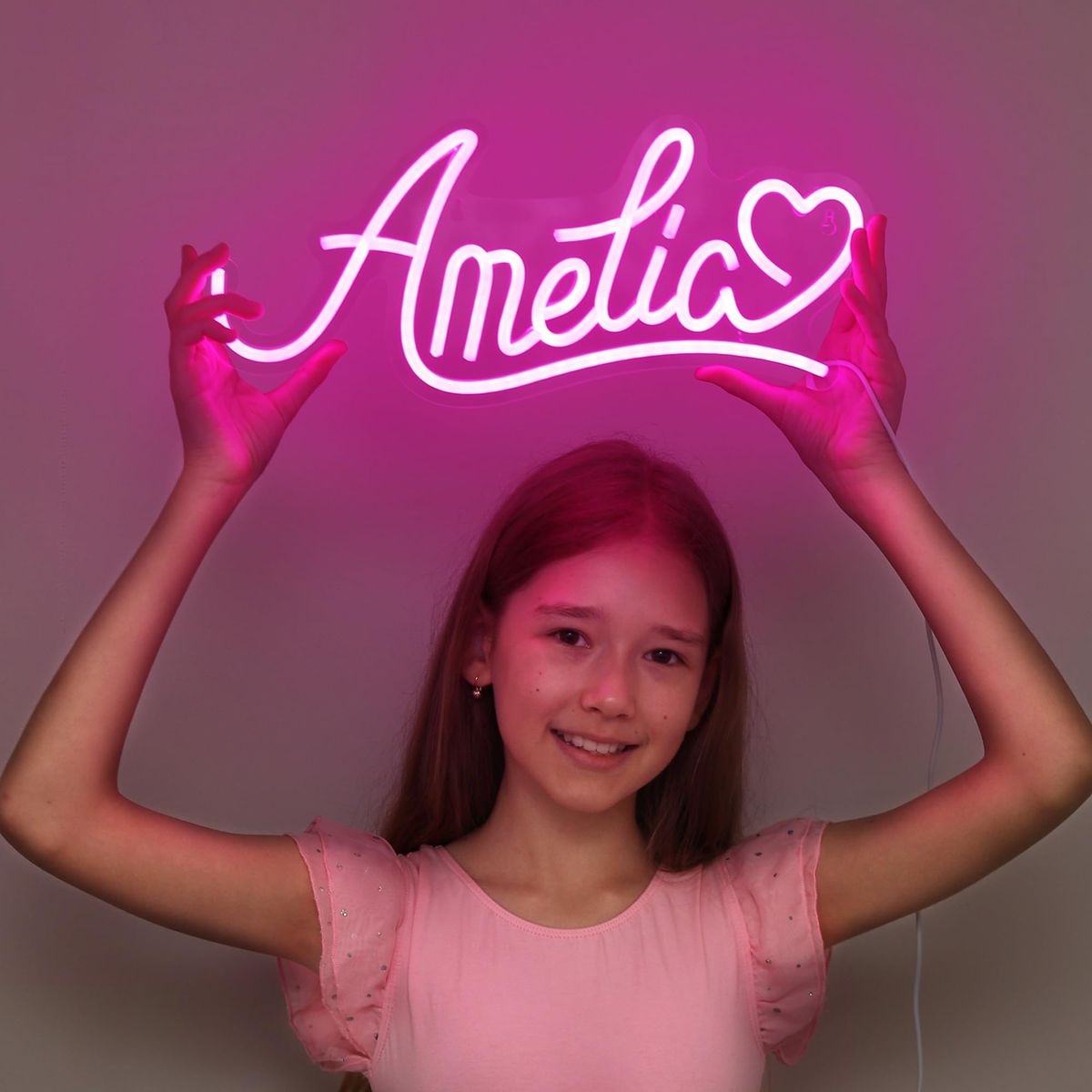 Amelia Name Neon sign by Neon.Outshine - adding a warm, elegant touch to a contemporary bedroom wall.