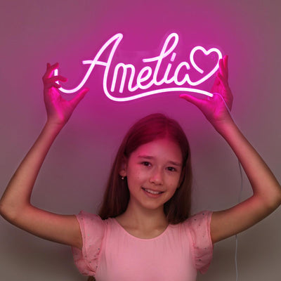 Amelia Name Neon sign by Neon.Outshine - adding a warm, elegant touch to a contemporary bedroom wall.