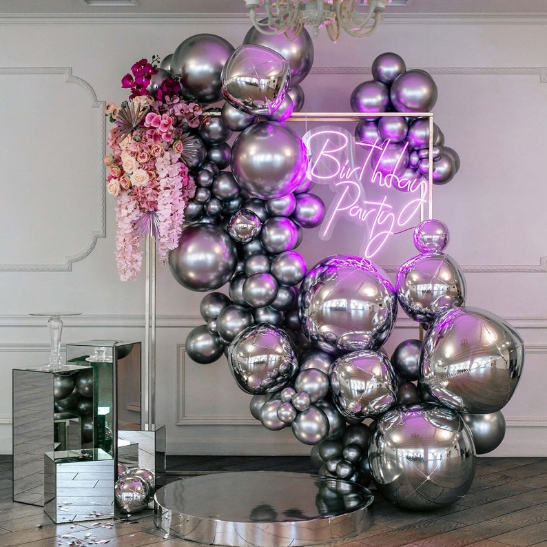 Birthday Party Neon Sign by Neon.Outshine glowing in bright neon color with festive lettering for party decor.