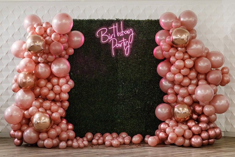 Birthday Party Neon Sign by Neon.Outshine glowing in bright neon color with festive lettering for party decor.