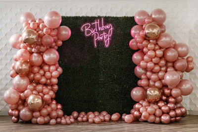 Birthday Party Neon Sign by Neon.Outshine glowing in bright neon color with festive lettering for party decor.