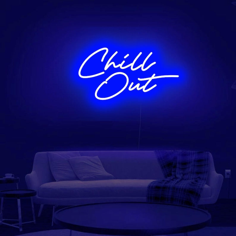 Chill Out  LED neon sign glowing in cool blue on a relaxed lounge wall -handcrafted by Neon.Outshine for parties and modern interiors.