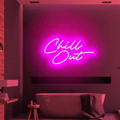 Chill Out  LED neon sign glowing in cool blue on a relaxed lounge wall -handcrafted by Neon.Outshine for parties and modern interiors.