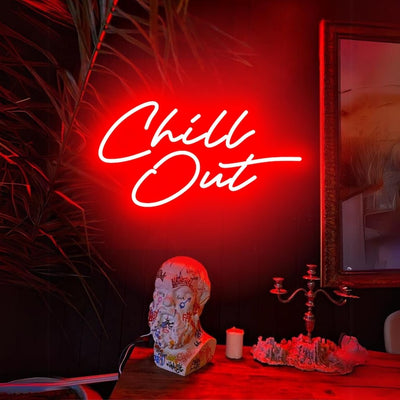 Chill Out  LED neon sign glowing in cool blue on a relaxed lounge wall -handcrafted by Neon.Outshine for parties and modern interiors.