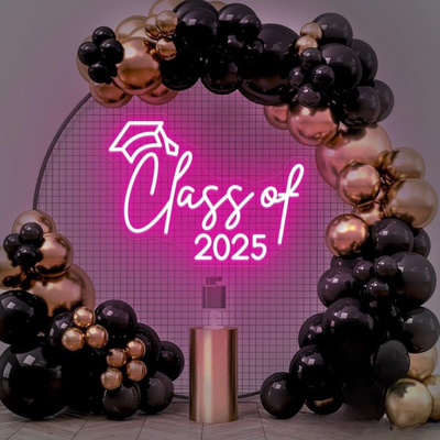 Class of 2025 Neon Sign by Neon.Outshine glowing in vibrant neon with bold graduation-themed lettering.
