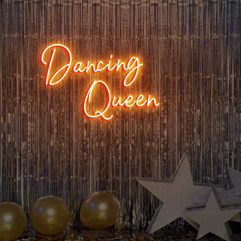 Dancing Queen Party Neon Sign by Neon.Outshine glowing with cursive lettering and star accents.