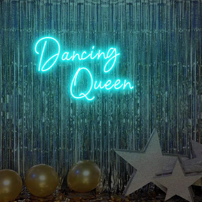 Dancing Queen Party Neon Sign by Neon.Outshine glowing with cursive lettering and star accents.