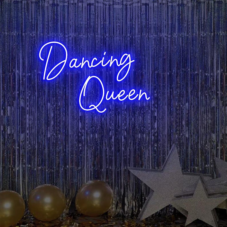 Dancing Queen Party Neon Sign by Neon.Outshine glowing with cursive lettering and star accents.