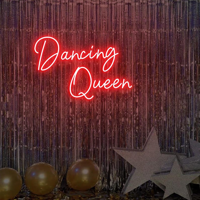 Dancing Queen Party Neon Sign by Neon.Outshine glowing with cursive lettering and star accents.