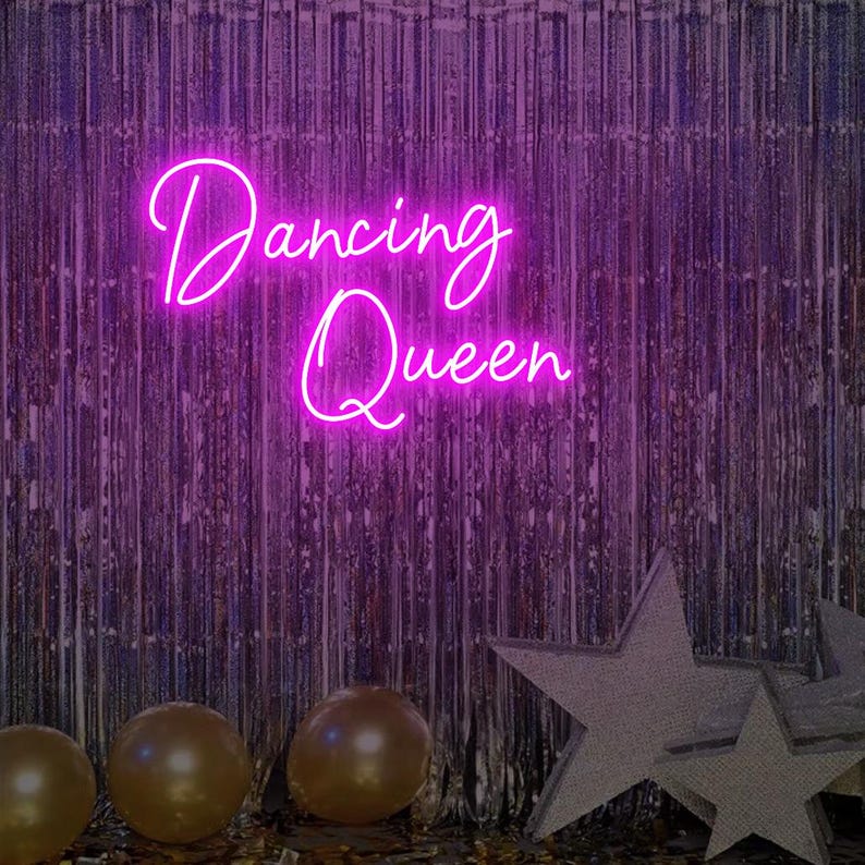 Dancing Queen Party Neon Sign by Neon.Outshine glowing with cursive lettering and star accents.