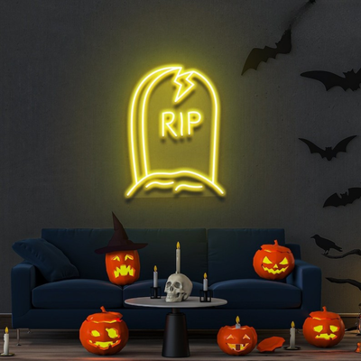 GRAVE RIP Halloween neon sign by Neon.outshine, shaped like a tombstone on clear acrylic backing, glowing in a dark spooky room."