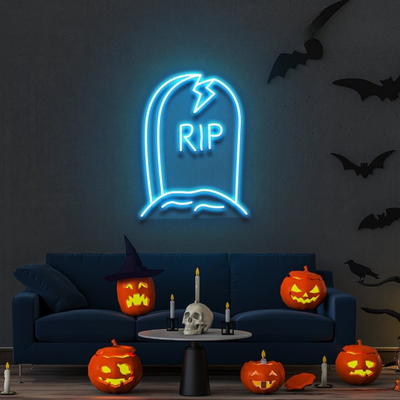 GRAVE RIP Halloween neon sign by Neon.outshine, shaped like a tombstone on clear acrylic backing, glowing in a dark spooky room."