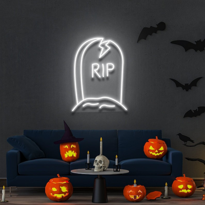 GRAVE RIP Halloween neon sign by Neon.outshine, shaped like a tombstone on clear acrylic backing, glowing in a dark spooky room."