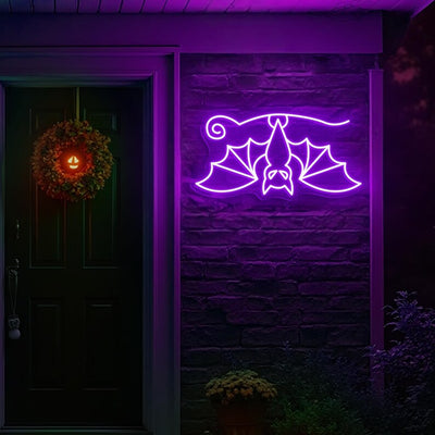 Hanging Bat Halloween Neon Sign glowing in bright LED neon lights by Neon. Outshine