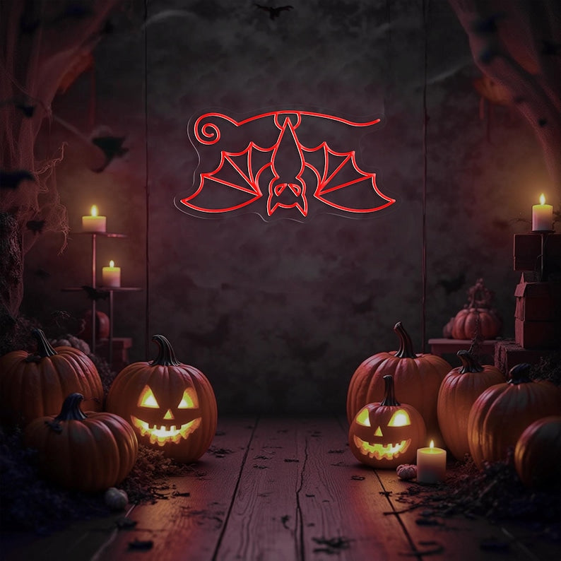 Hanging Bat Halloween Neon Sign glowing in bright LED neon lights by Neon. Outshine