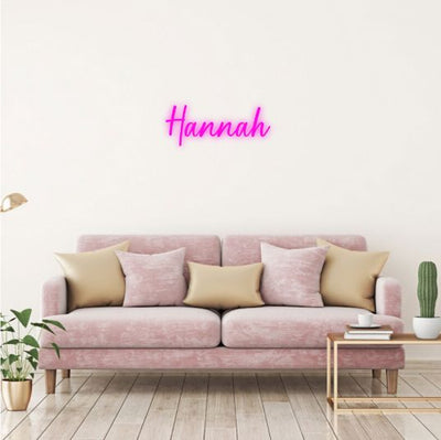 Hannah Name Neon sign  in glowing script, ideal for bedroom decoration, nursery walls, or personalized gift ideas by Neon.Outshine 