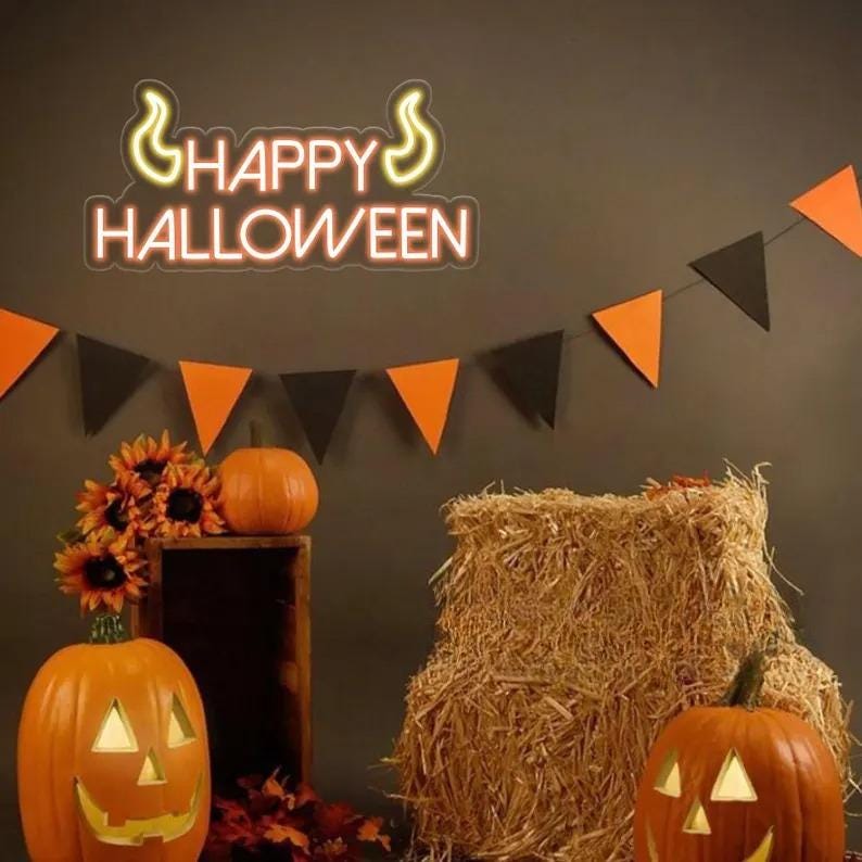 Happy Halloween Neon Sign by Neon.Outshine glowing orange and white LED festive wall décor for Halloween parties, trick-or-treat entrances, bars, and home displays.