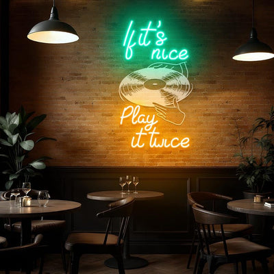 If It's Nice Play It Twice Neon sign glowing in LED lights, mounted on clear acrylic – stylish music-inspired wall decor by Neon.Outshine.