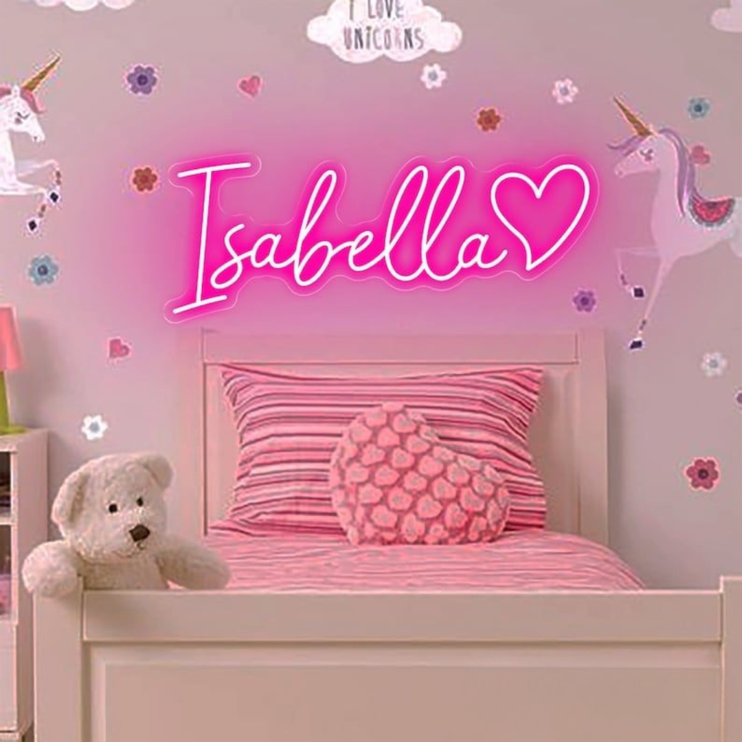 Isabella Name Neon sign By Neon.Outshine - in elegant script, casting a soft pink light on a bedroom wall.