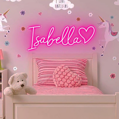 Isabella Name Neon sign By Neon.Outshine - in elegant script, casting a soft pink light on a bedroom wall.