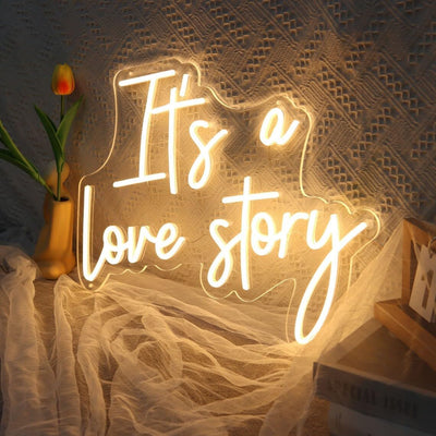 It’s a Love Story Wedding Neon Sign by Neon.Outshine glowing romantically behind on the  wedding backdrop