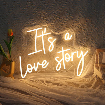 It’s a Love Story Wedding Neon Sign by Neon.Outshine glowing romantically behind on the  wedding backdrop