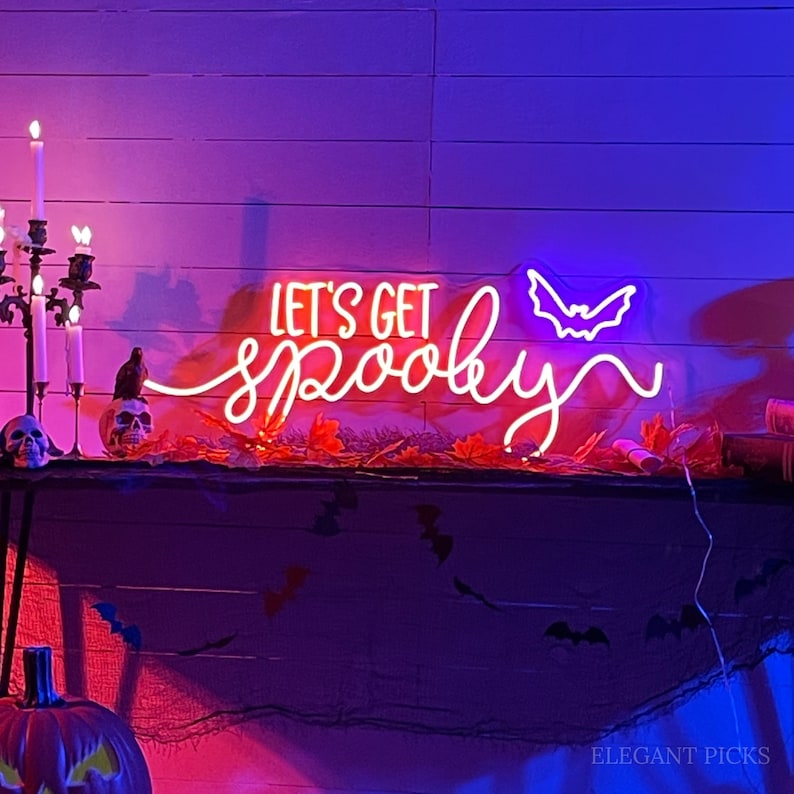 Let’s Get Spooky Halloween Neon Sign glowing in vibrant LED lights, ideal for festive Halloween décor and party backdrops by Neon.Outshine