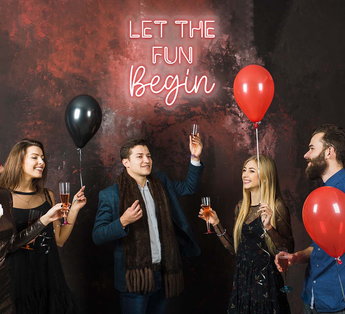 Let the Fun Begin neon sign in glowing LED lights, mounted on clear acrylic – stylish event decor by Neon.Outshine.