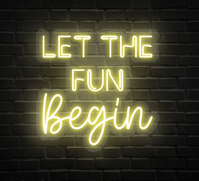 Let the Fun Begin neon sign in glowing LED lights, mounted on clear acrylic – stylish event decor by Neon.Outshine.