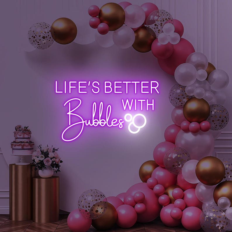 Life is Better with Bubbles Neon Sign by Neon.Outshine in glowing cursive script with optional bubble or champagne glass accents.