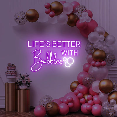 Life is Better with Bubbles Neon Sign by Neon.Outshine in glowing cursive script with optional bubble or champagne glass accents.