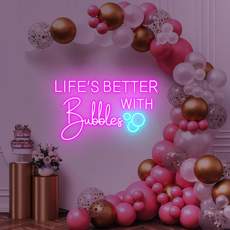 Life is Better with Bubbles Neon Sign by Neon.Outshine in glowing cursive script with optional bubble or champagne glass accents.