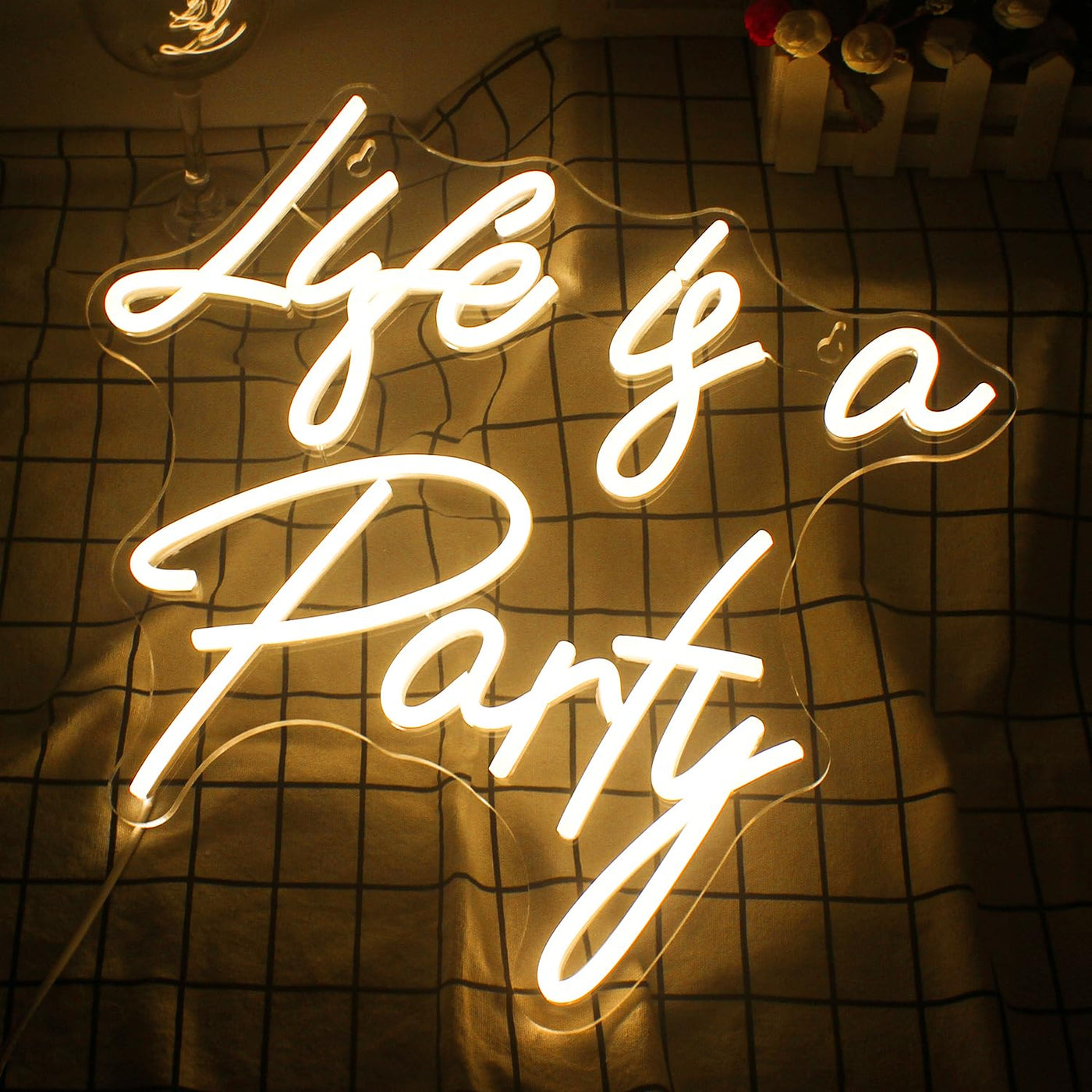 Life is a Party Neon sign in glowing LED lights, mounted on a clear acrylic board - stylish and festive wall decor by Neon.Outshine.