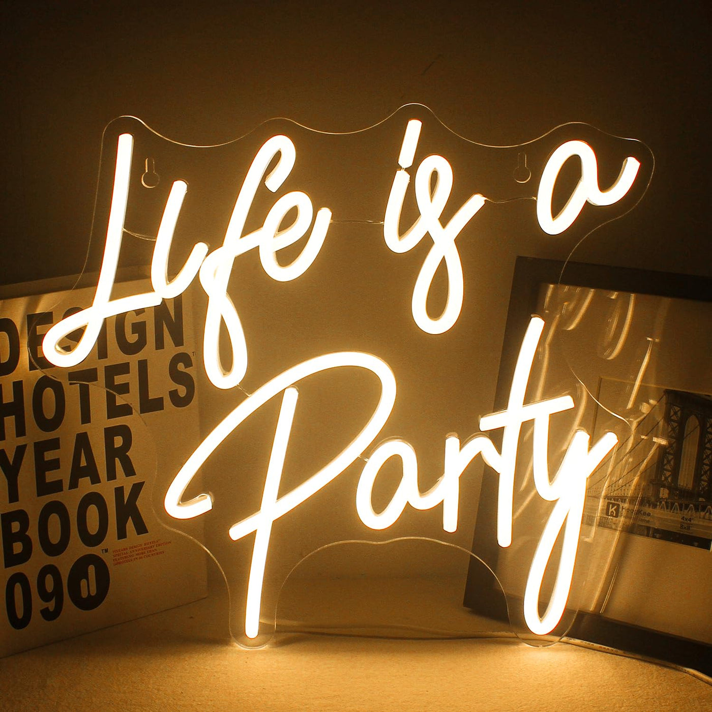 Life is a Party Neon sign in glowing LED lights, mounted on a clear acrylic board - stylish and festive wall decor by Neon.Outshine.