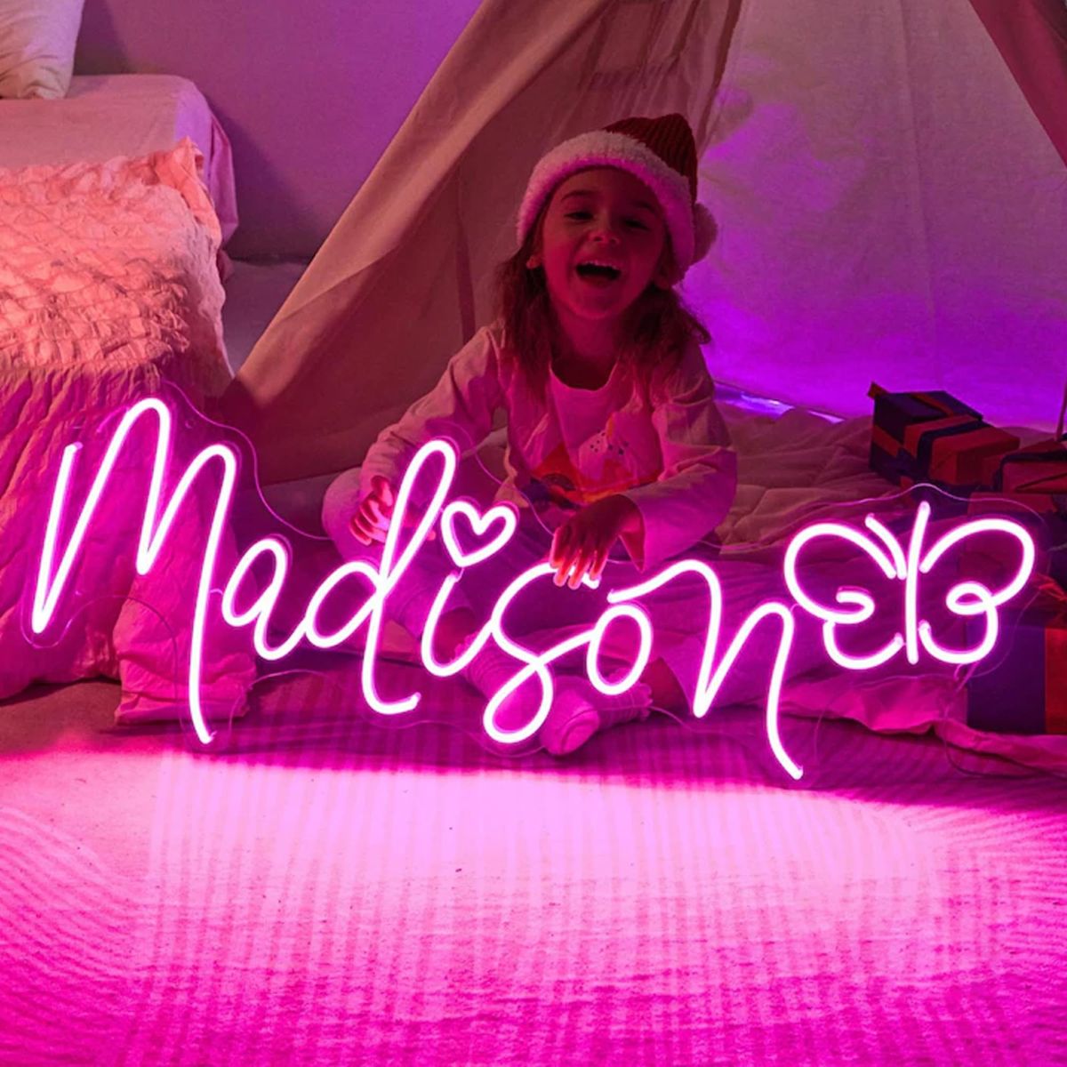 Madison Name Neon sign glowing brightly on a clear acrylic backing - Neon.Outshine 