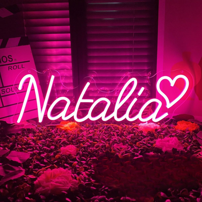 Personalized 'Natalia' name neon sign in lavender, mounted on clear acrylic – Neon.Outshine