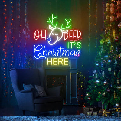 Oh Deer Christmas is Here Neon Sign by Neon.Outshine – playful LED neon light featuring holiday text with reindeer antlers for festive Christmas décor.