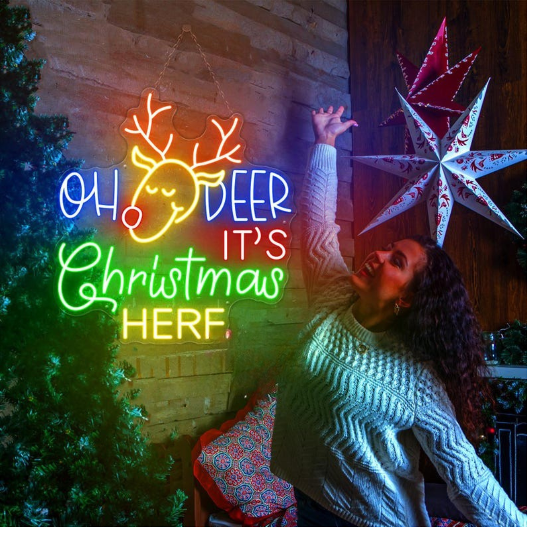 Oh Deer Christmas is Here Neon Sign by Neon.Outshine – playful LED neon light featuring holiday text with reindeer antlers for festive Christmas décor.