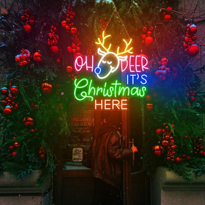 Oh Deer Christmas is Here Neon Sign by Neon.Outshine – playful LED neon light featuring holiday text with reindeer antlers for festive Christmas décor.