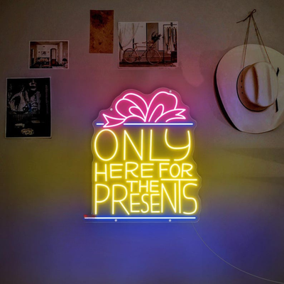 Only Here For The Presents Christmas Neon Sign by Neon.Outshine glowing in festive lights