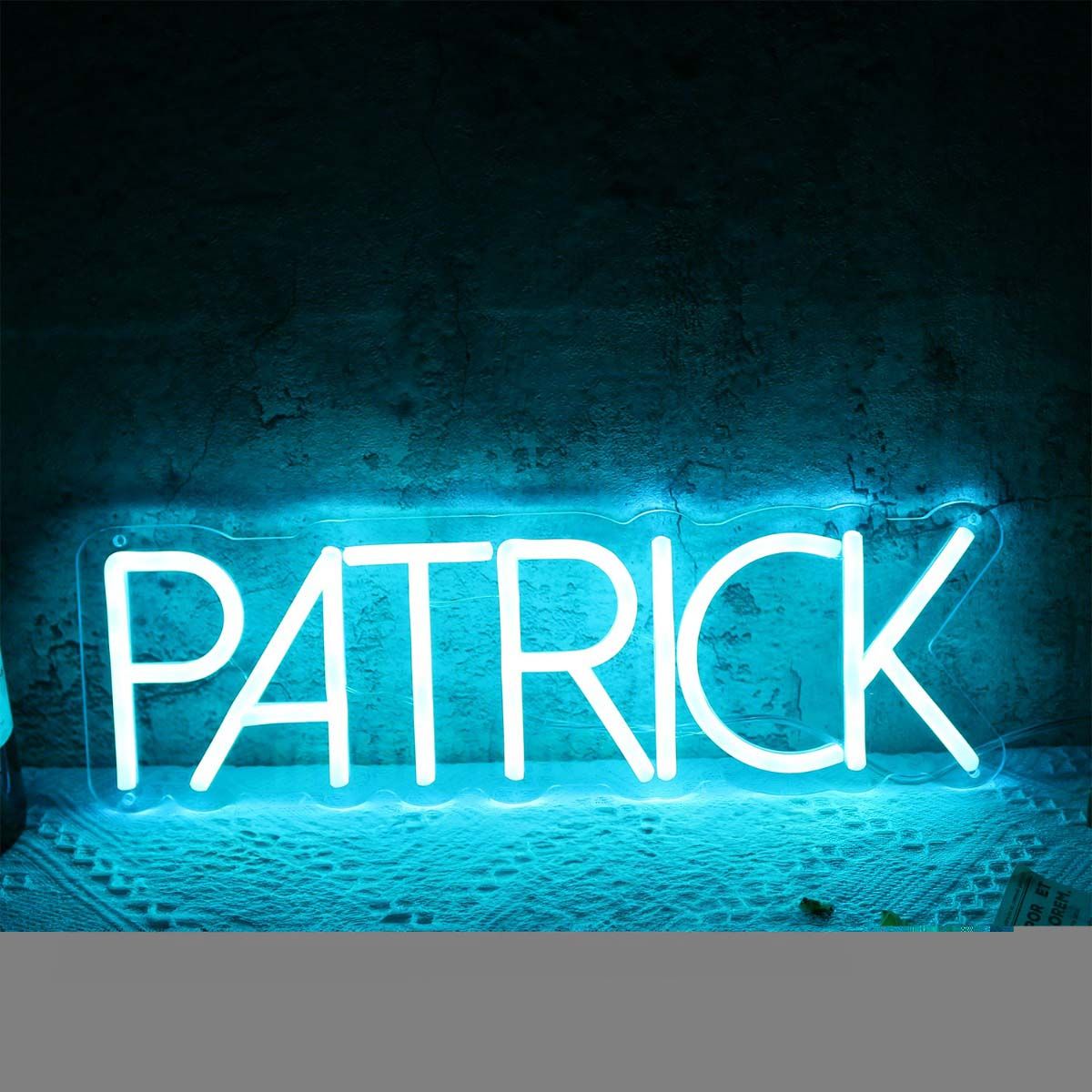 Patrick Name Neon sign glowing in warm white on bedroom wall - Neon.Outshine 