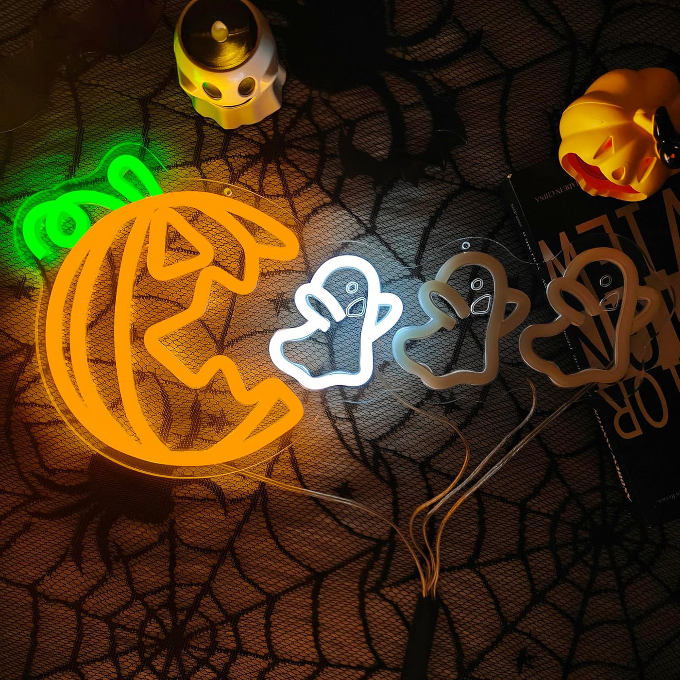 Pumpkin Eat Ghost Halloween Neon Sign by Neon.Outshine glowing LED orange pumpkin with white ghost festive wall décor for parties, bars, and Halloween displays.