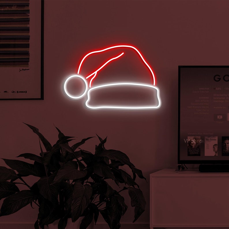 Santa Hat Christmas Neon Sign by Neon.Outshine – festive LED neon light shaped like Santa’s red hat with white trim for Christmas décor.