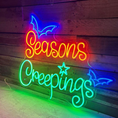 Seasons Creepings Halloween LED Neon Sign glowing in bright LED neon lights by Neon.Outshine