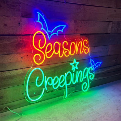 Seasons Creepings Halloween LED Neon Sign glowing in bright LED neon lights by Neon.Outshine