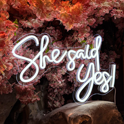 She Said Yes Wedding Neon Sign by Neon.Outshine glowing in elegant LED light at an engagement celebration backdrop.