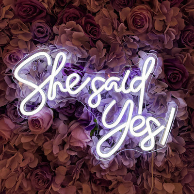 She Said Yes Wedding Neon Sign by Neon.Outshine glowing in elegant LED light at an engagement celebration backdrop.