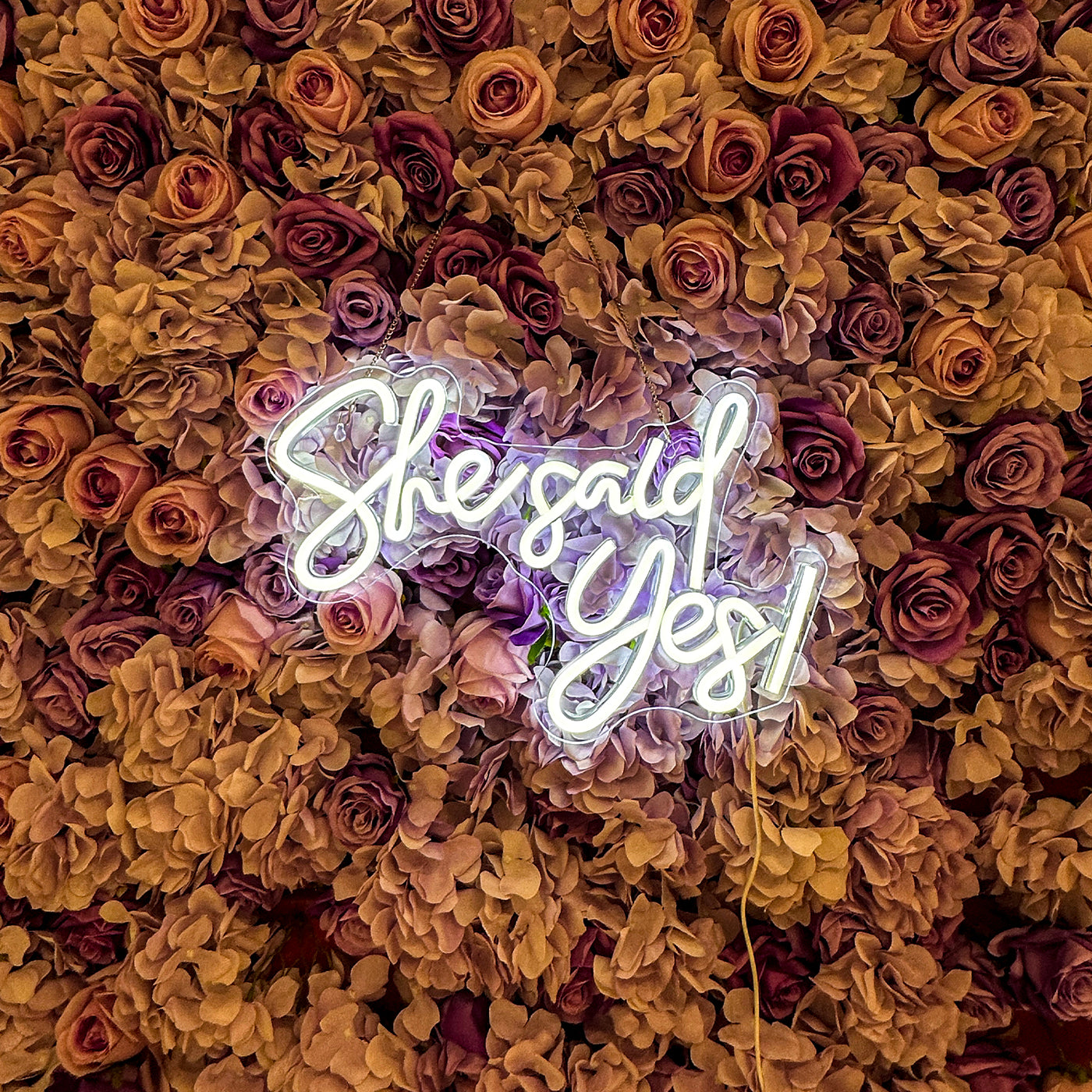 She Said Yes Wedding Neon Sign by Neon.Outshine glowing in elegant LED light at an engagement celebration backdrop.
