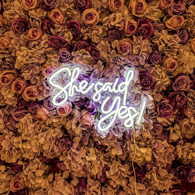 She Said Yes Wedding Neon Sign by Neon.Outshine glowing in elegant LED light at an engagement celebration backdrop.