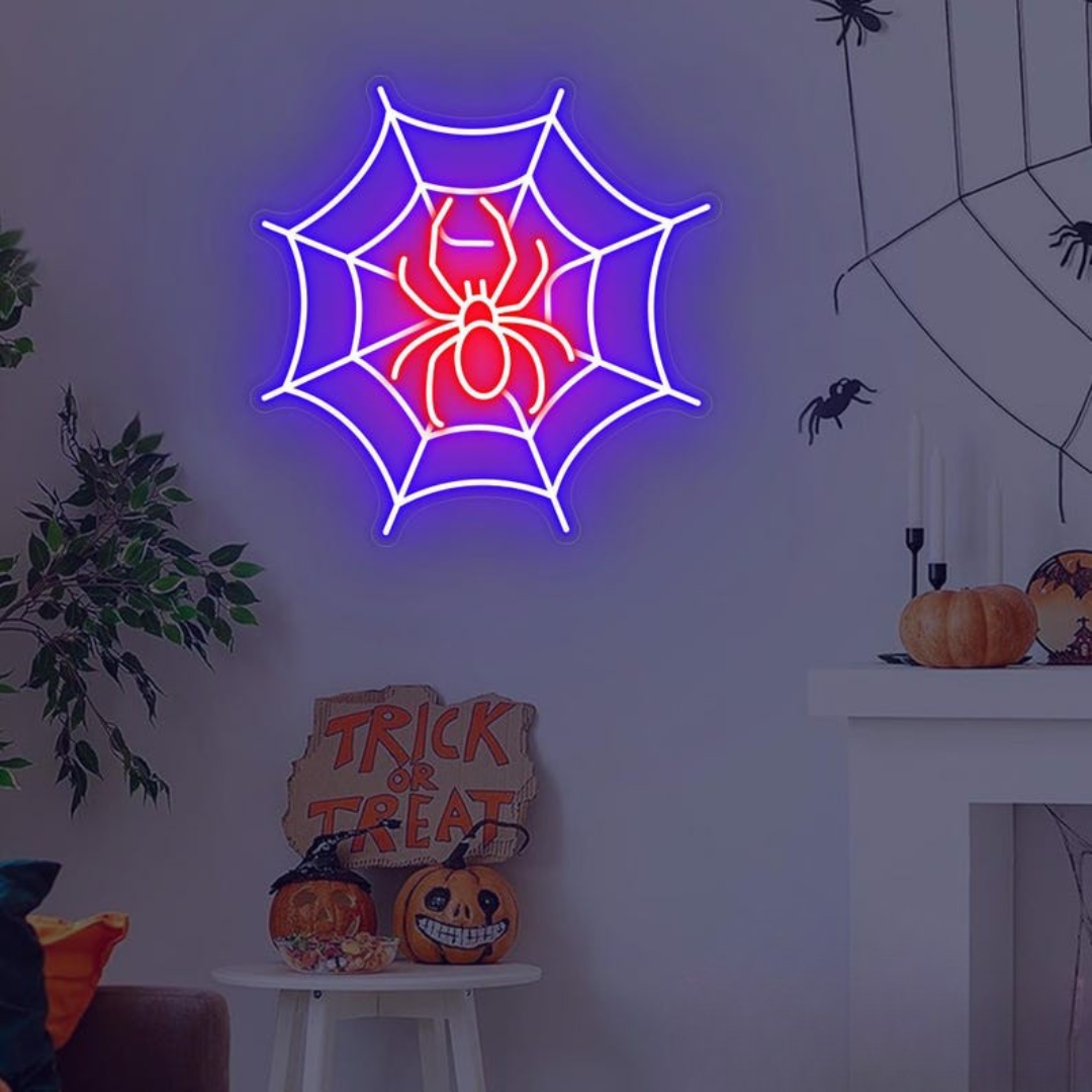 Spider web neon sign by Neon.outshine in glowing  LED Lights mounted on clear acrylic in a dark Halloween room.
